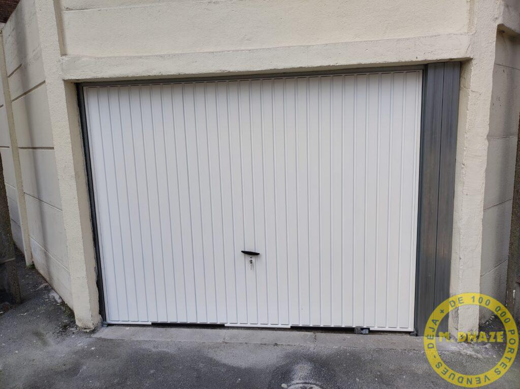 Installation d’une porte basculante à Wervicq dans le Nord.