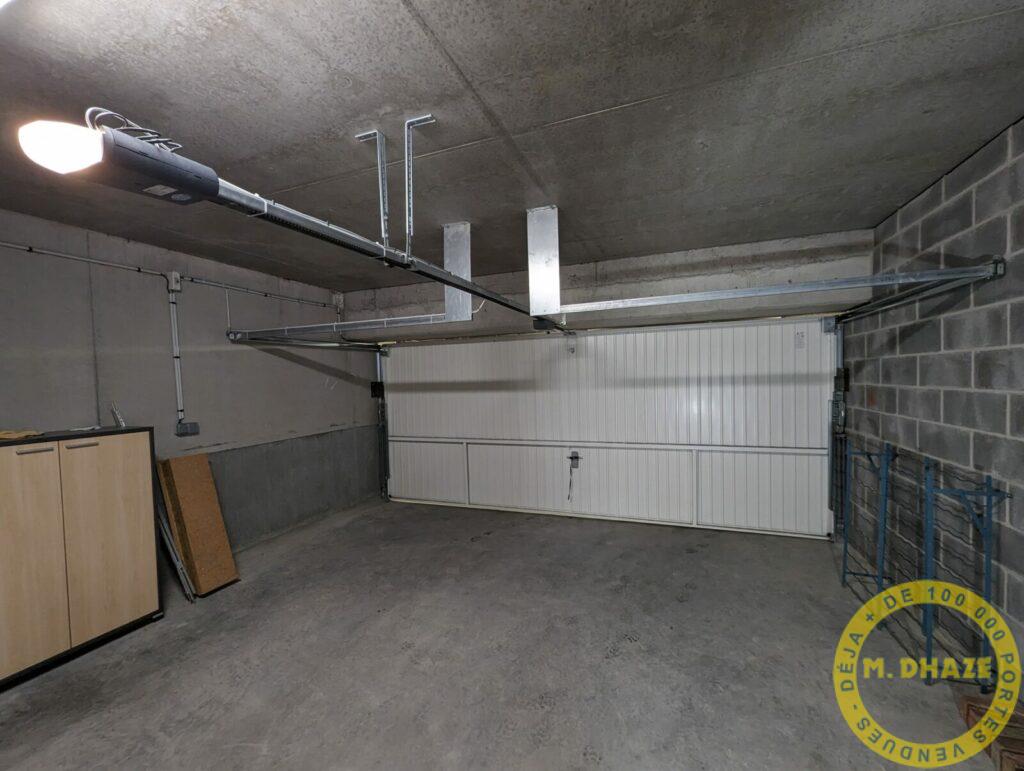 Installation d’une motorisation sur porte basculante. à Wambrechies (59)