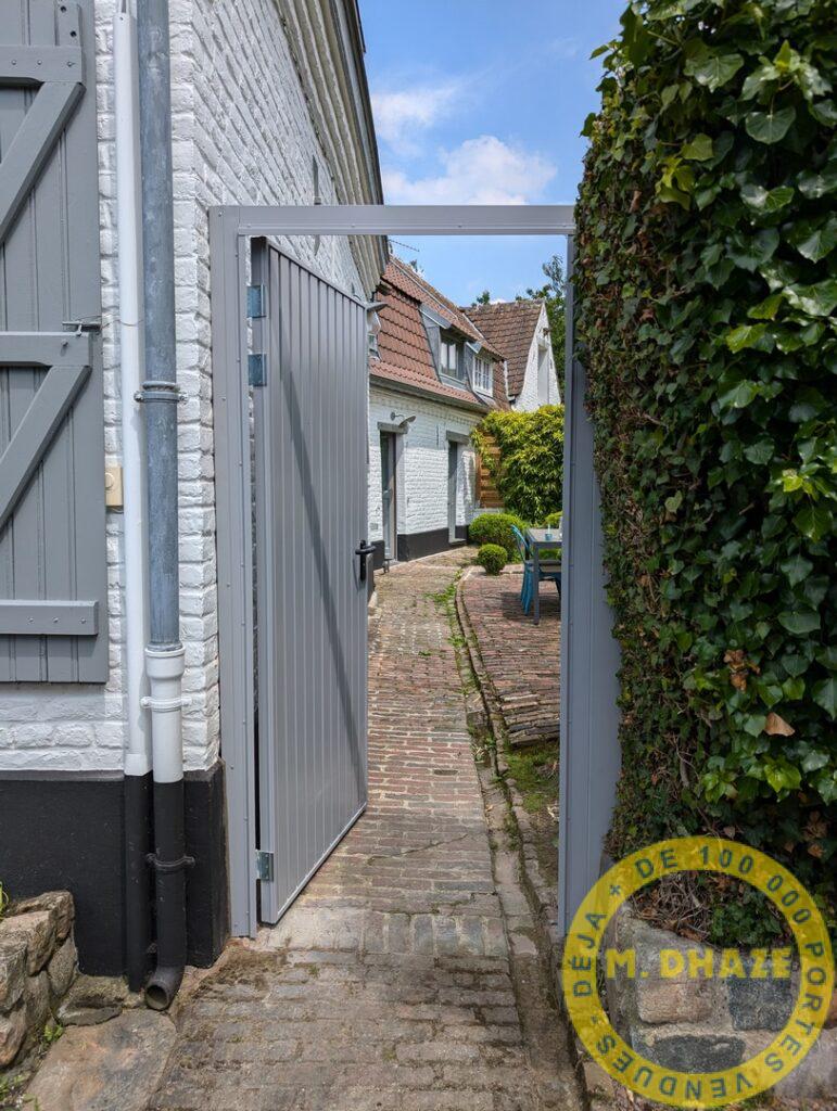 Installation d’une porte de service et accès jardin, Mini DL de Novoferm à  Comines.
